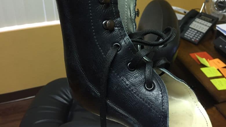 A Close-Up View Of A Black Object With Laces Inside Of It. | Evolve Prosthetics &Amp; Orthotics A Close-Up View Of A Black Object With Laces Inside Of It.