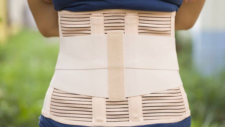 A Person In A Spinal Brace.