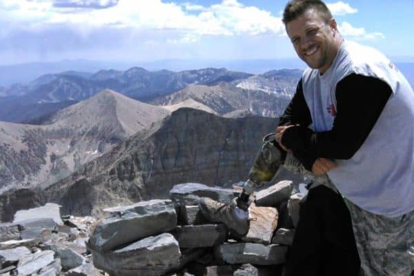 Military Veteran With Prosthetic Perched On The Side Of A Mountain | Evolve Prosthetics &Amp; Orthotics Military Veteran With Prosthetic Perched On The Side Of A Mountain
